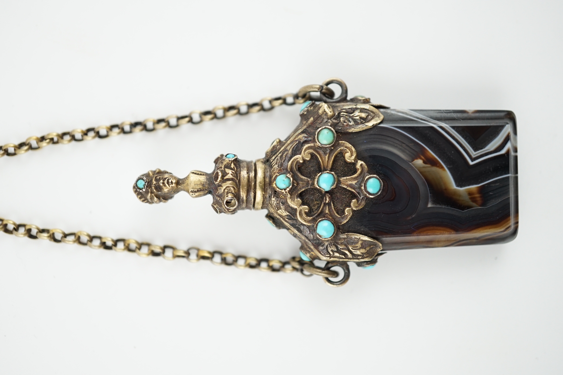 A 19th century continental gilt metal and turquoise cabochon set banded agate scent bottle